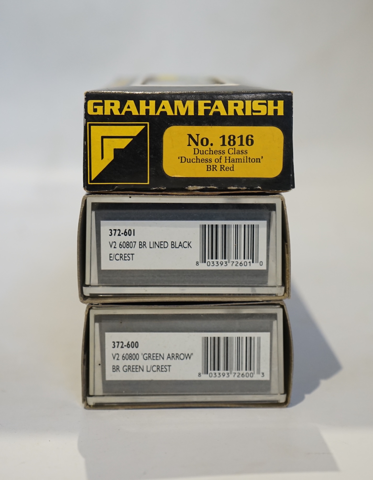 Three boxed Graham Farish N gauge railway BR tender locomotives; a Coronation Class, Duchess of Hamilton (1816), a Class V2, 60807 (372-601), and a Class V2, 60800 (372-600). Condition - good.